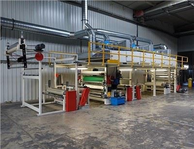 Sohvakankaiden pronssointikone